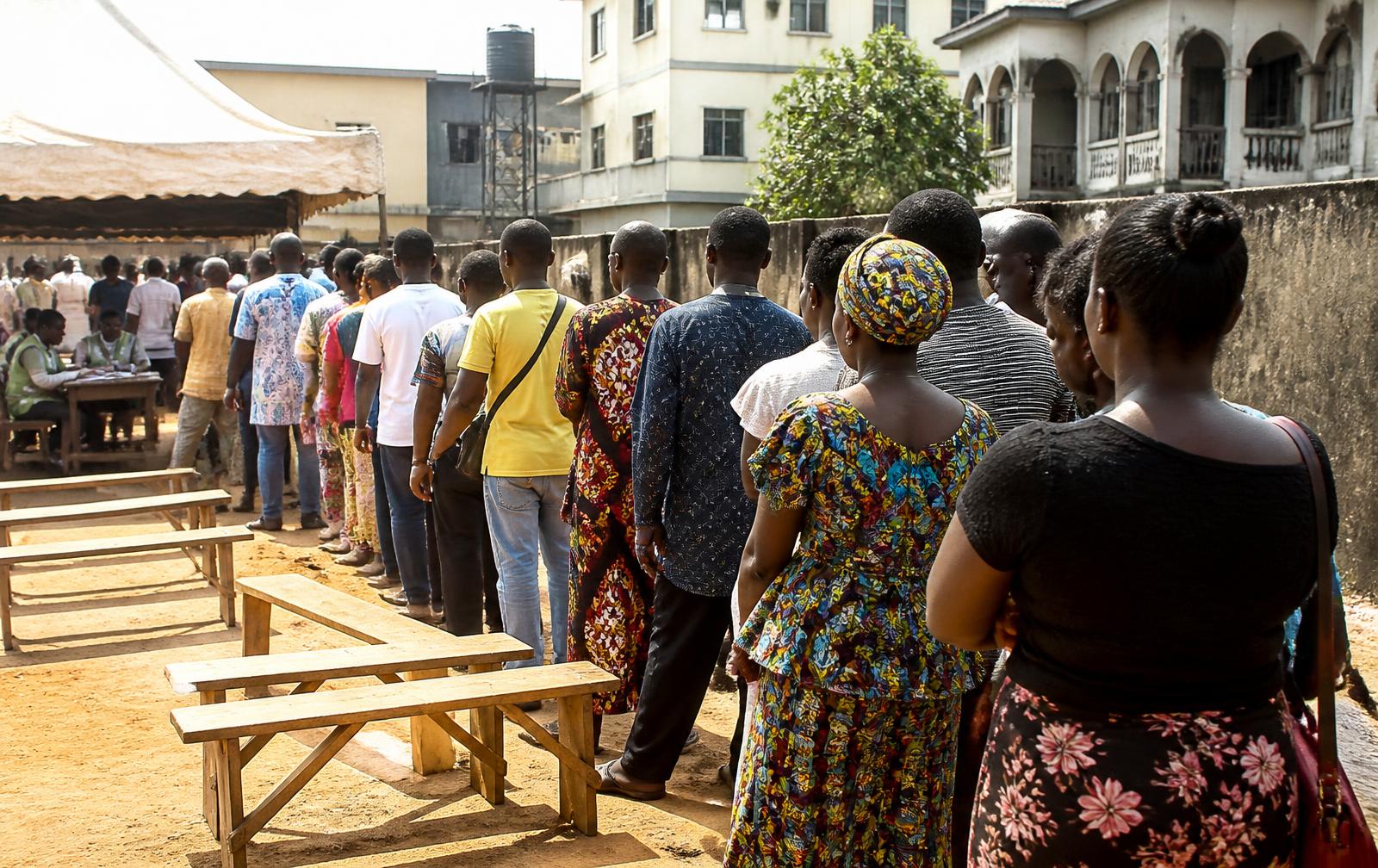 Voters queuing at a Nigerian polling unit on election morning